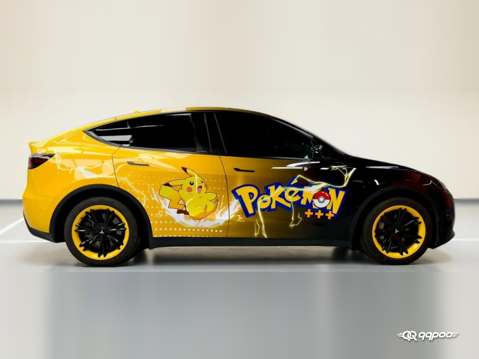 Side view of a yellow and black Pikachu car wrap with Pokémon lettering and lightning graphics.